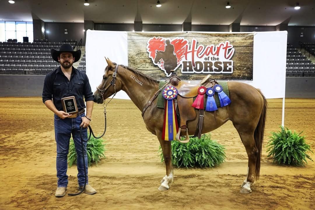 Tyler McDermett with his horse, award plaque, and Heart of the Horse ribbons